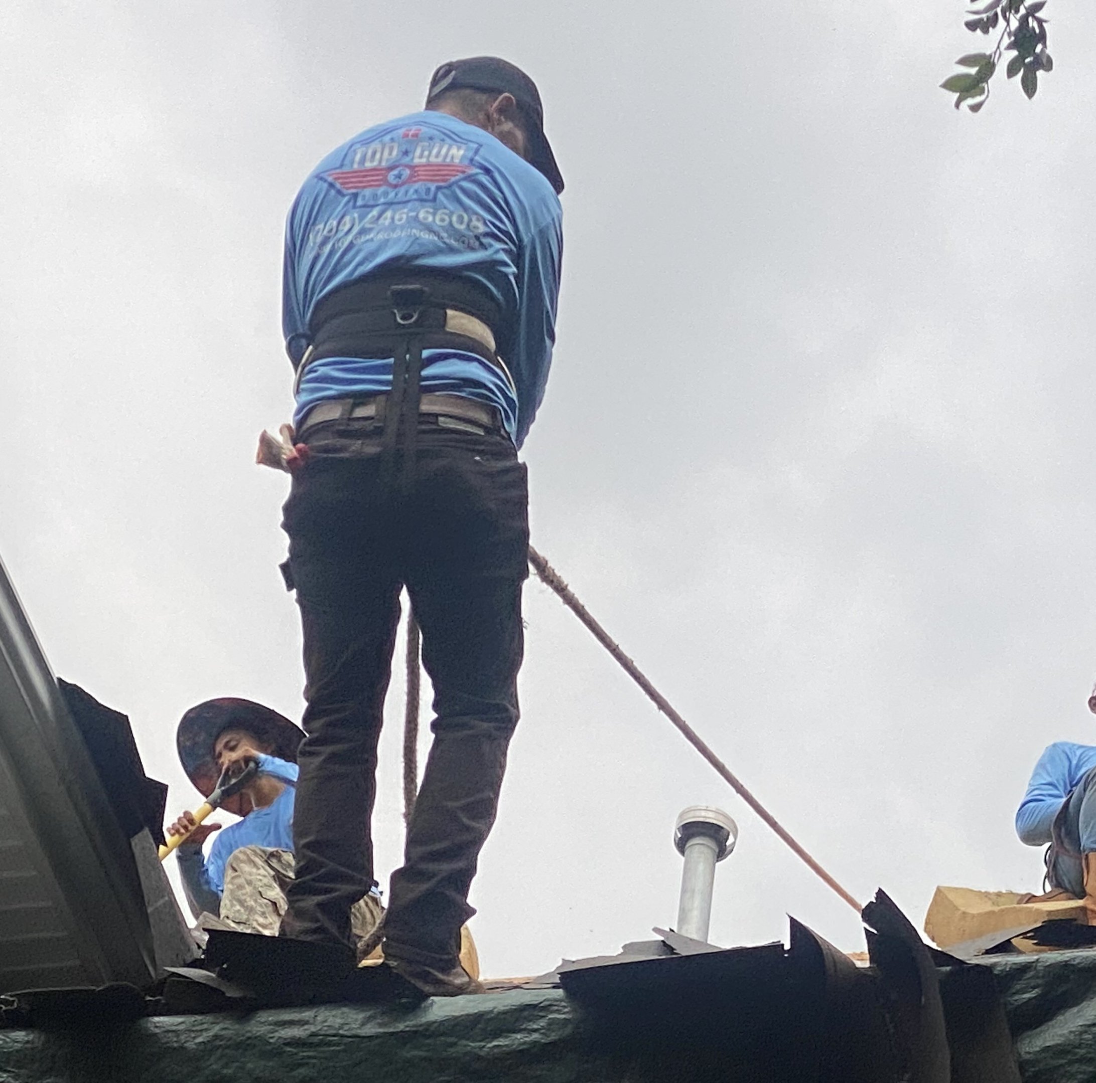 Top Gun Roofing crew working on a residential roof